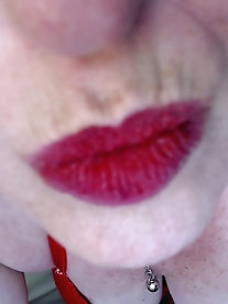 Seductive mature woman displaying her breast